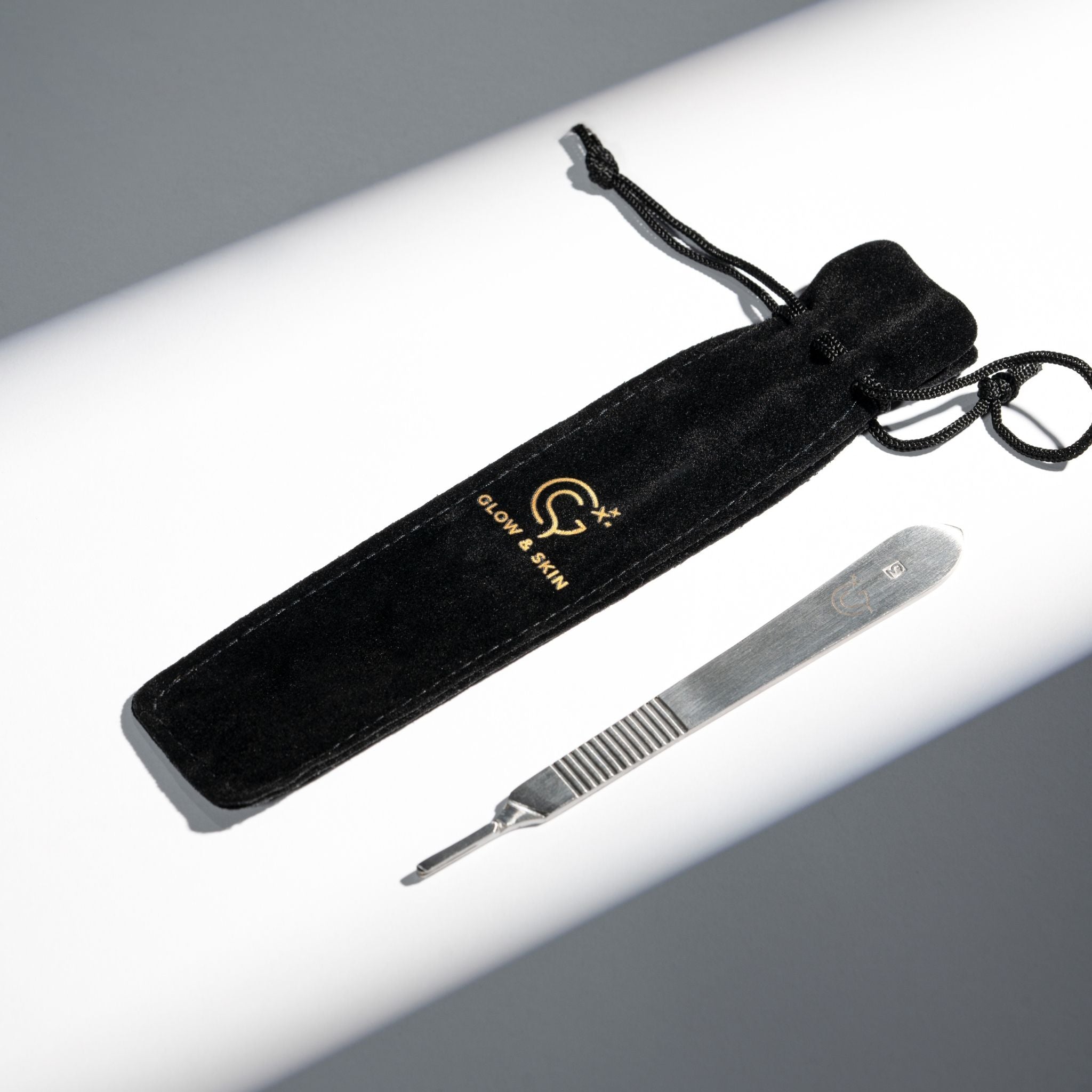 Premium professional dermaplaning tool made of high-quality stainless steel, featuring a secure grip design for precision in facial treatments